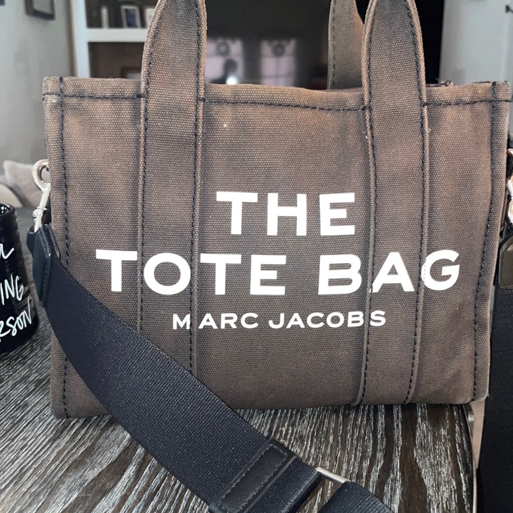 Authentic used as shown discoloration and a minor rip on handle no other damage.